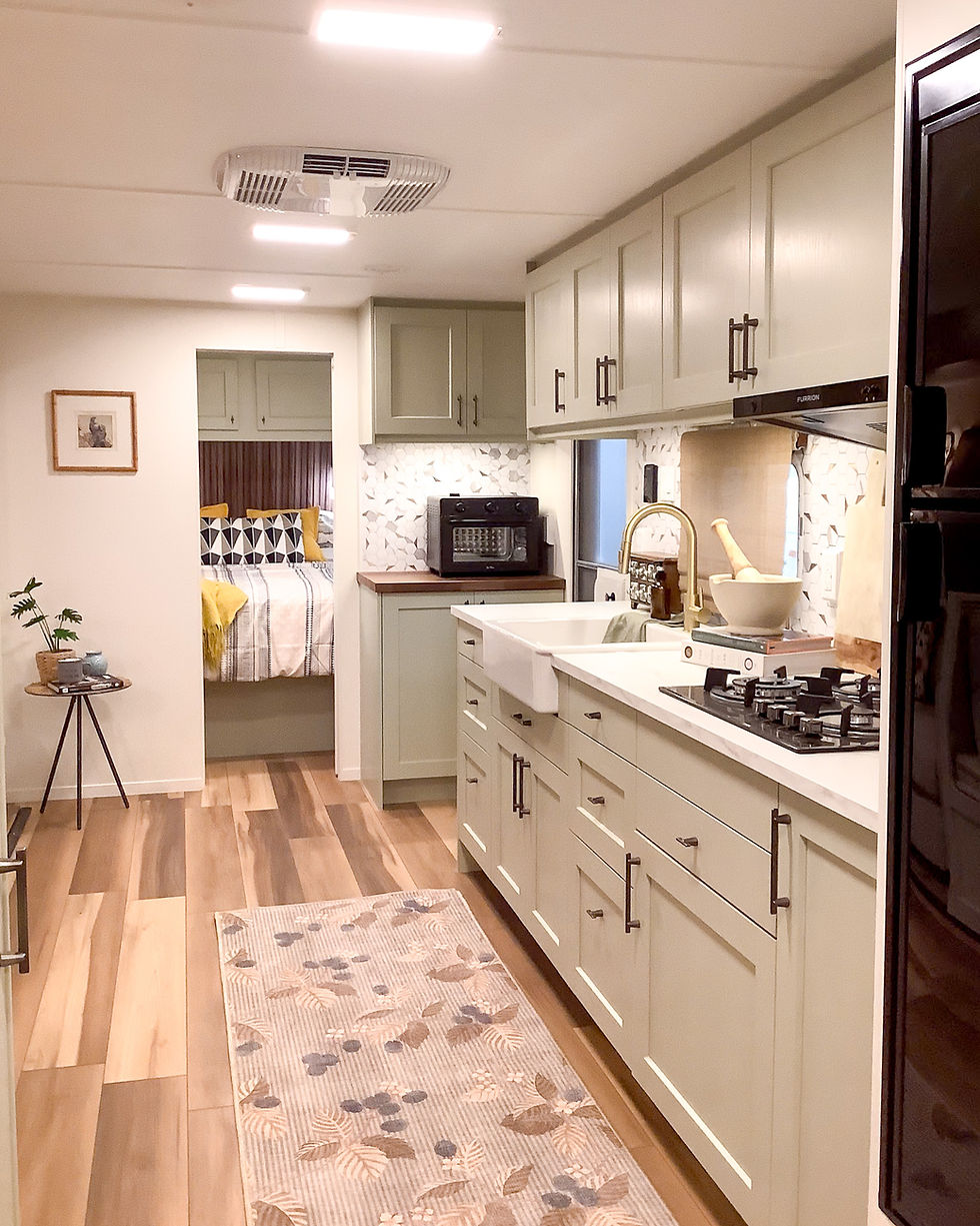 Spacious custom kitchen in a renovated 2007 Jay Flight.